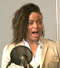Female singer practises vocal cord exercises