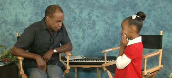 Young girl learning how to sing